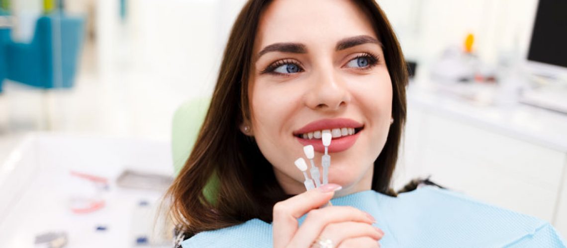 dental patient receiving teeth whitening treatment using dental veneers.