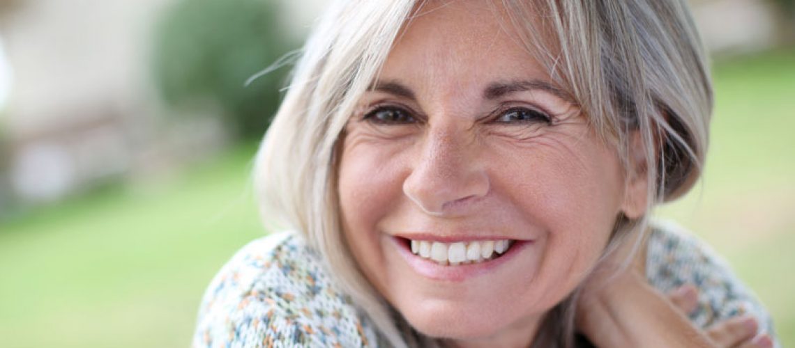 a dental patient smiling after a dental visit